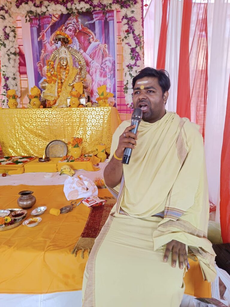 Person in traditional attire at altar.